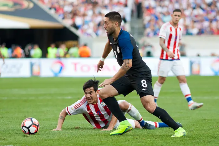 U.S. forward Clint Dempsey (8) takes on Paraguay's Gustavo Gomez during the USMNT's 1-0 victory at Philadelphia's Lincoln Financial Field on Saturday.